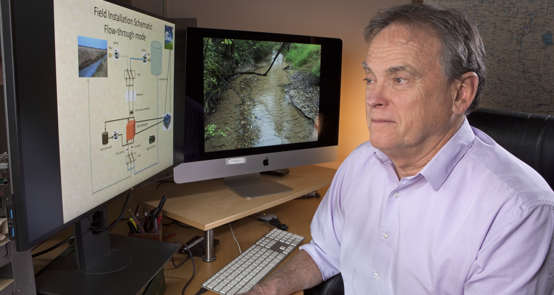 Scientist reviewing a slide on a computer screen 