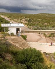 ARS technicians prepare a flume for monitoring runoff from the Walnut Gulch Experimental Watershed.