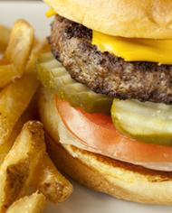 A cheeseburger and French fries